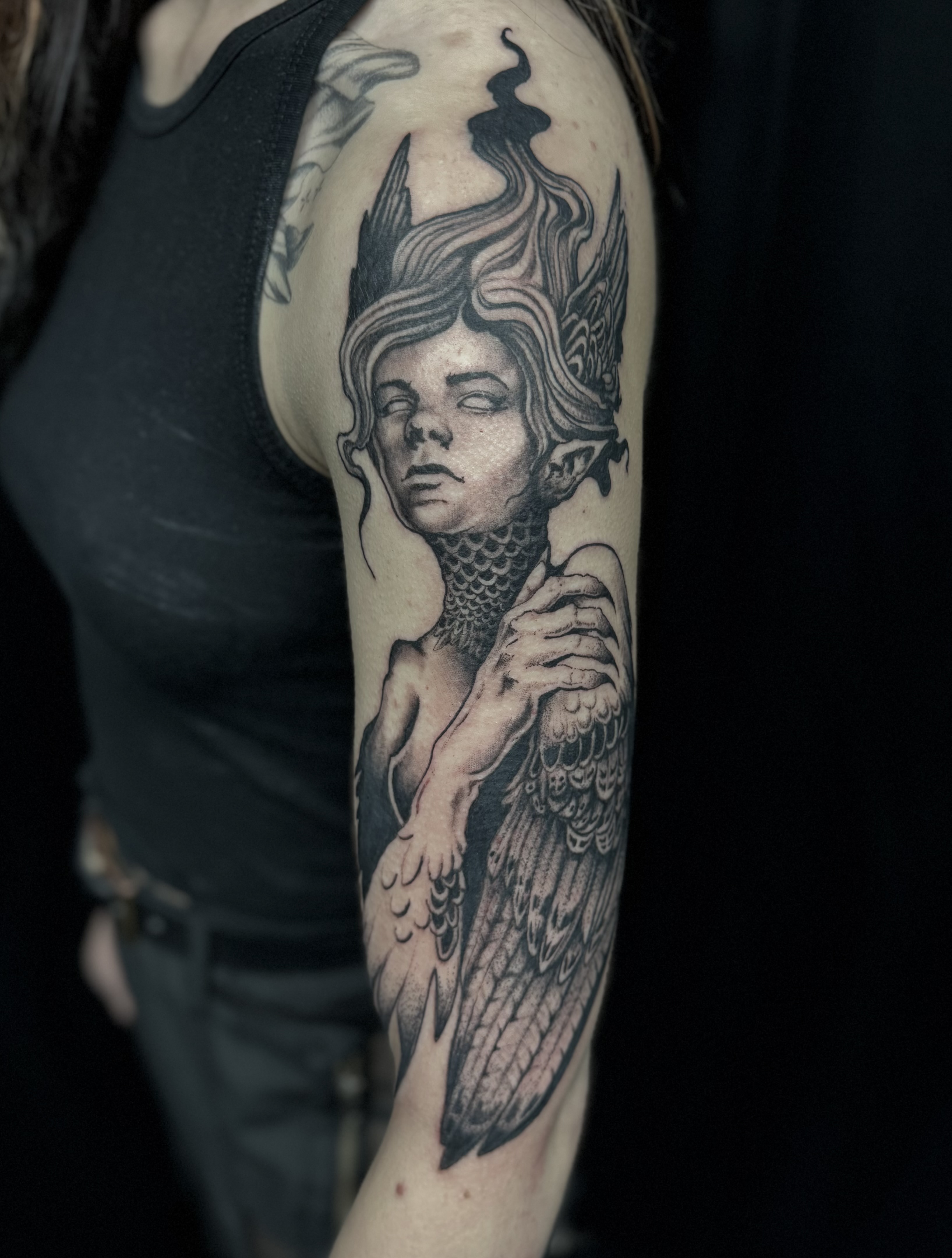Illustrative winged figure tattoo by Cesar — Gold Scarab Tattoo Seattle